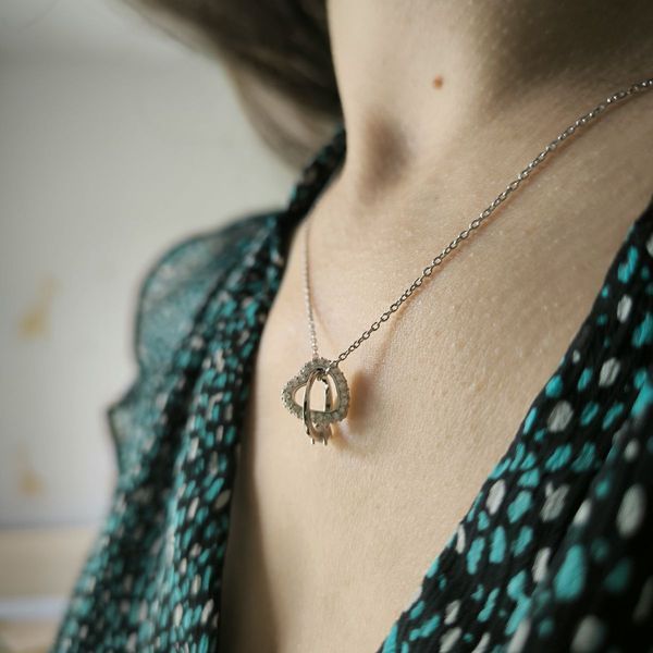 Серебряный кулон в форме двойного сердца с фианитами 0540044755812 Серебряный кулон в форме двойного сердца с фианитами фото с каталога