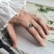 купити срібний виріб Срібна каблучка LoveR з нано-смарагдом круглої форми в ореолі з фіанітів 18 розмір фото 7 - фотографія з каталогу
