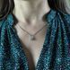 купить серебряное изделие Серебряная подвеска 925 пробы с круглыми фианитами в цветочной форме фото 7 - фотография из каталога