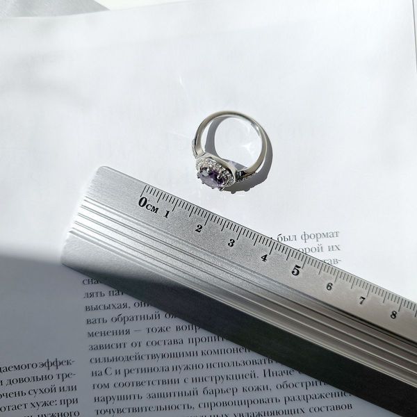 Серебряное кольцо с аметистом и фианитами в круговой оправе 17.5 размер 5712133612 Серебряное кольцо с аметистом и фианитами в круговой оправе фото с каталога