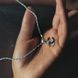 купить серебряное изделие Серебряная подвеска LoveR в форме двойного символа с фианитами фото 6 - фотография из каталога