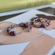 купить серебряное изделие Серебряные серьги-кольца с натуральным рубином овальной формы и фианитами фото 5 - фотография из каталога
