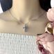 купить серебряное изделие Серебряный крестик с овальными камнями мистического топаза фото 4 - фотография из каталога